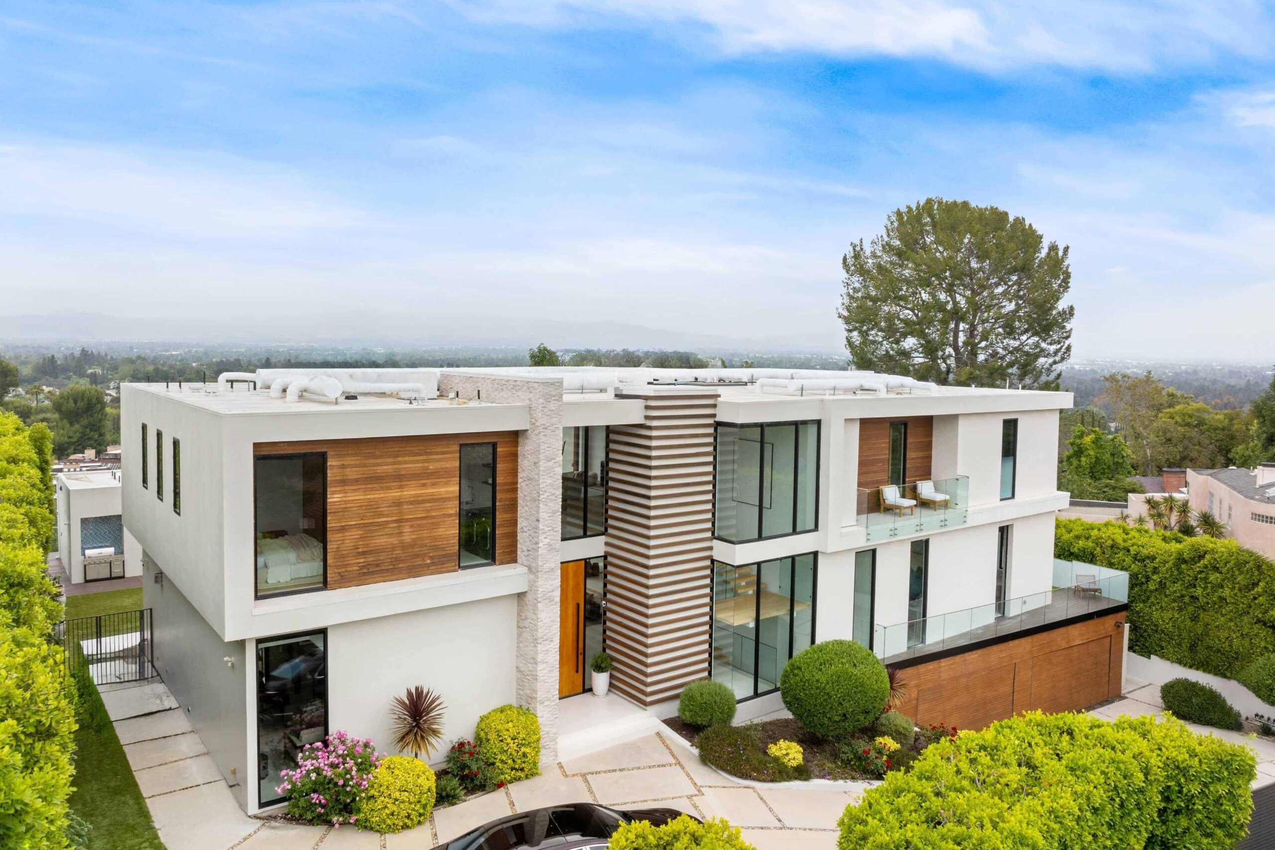 aerial-view-of-a-contemporary-home-with-a-lush-ga-2024-06-18-18-28-29-utc-transformed
